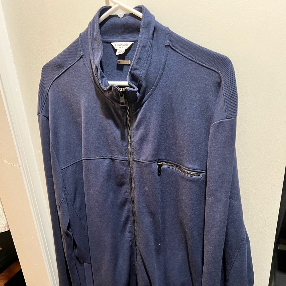 Calvin Klein navy blue light weight cotton feel jacket.